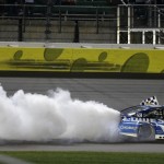 
              NASCAR driver Jimmie Johnson (48) celebrates his win following the NASCAR Sprint Cup series auto race at Kansas Speedway in Kansas City, Kan., Saturday, May 9, 2015. (AP Photo/Orlin Wagner)
            