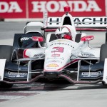 
              Helio Castroneves, of Brazil, makes a corner during practice for the IndyCar auto race, Saturday, June 13, 2015, in Toronto. (Nathan Denette/The Canadian Press via AP)
            