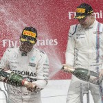 
              Winner Mercedes driver Lewis Hamilton, left, of Great Britain, is sprayed by third place finisher Williams driver Valtteri Bottas of Finland during victory ceremonies at the Canadian Grand Prix in Montreal on Sunday, June 7, 2015. (Paul Chiasson /The Canadian Press via AP) MANDATORY CREDIT
            