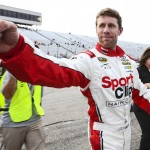 
              Carl Edwards fist-bumps after winning the pole position qualifying for Sunday's NASCAR Sprint Cup series auto race at New Hampshire Motor Speedway in Loudon, N.H., Friday, July 17, 2015. (AP Photo/Cheryl Senter)
            