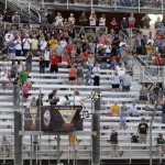 
              In this July 12, 2015, photo, fans watch the IndyCar Series race at the Milwaukee Mile in West Allis, Wis. Uncertainty looms again at the Milwaukee Mile. The venerable oval has the respect of IndyCar drivers who like the challenge of the flat track. What promoters needed going into this year’s IndyCar race was more fans, at least enough of a healthy enough showing to keep the Mile on the IndyCar schedule. By (AP Photo/Jeffrey Phelps)
            