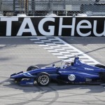 
              Max Chilton reacts as he crosses the finish line to win the Indy Lights Series auto race Saturday, July 18, 2015, at Iowa Speedway in Newton, Iowa. (AP Photo/Charlie Neibergall)
            