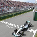 
              Mercedes driver Lewis Hamilton of Great Britain crosses the finish line to take the checkered flag and win the Canadian Grand Prix in Montreal on Sunday, June 7, 2015.   (Paul Chiasson/The Canadian Press via AP) MANDATORY CREDIT
            