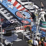 
              Austin Dillon (33) takes the checkered flag to win the NASCAR Xfinity series auto race at Charlotte Motor Speedway in Concord, N.C., Saturday, May 23, 2015. (AP Photo/Gerry Broome)
            