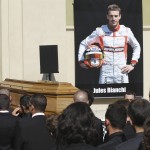 
              Pallbearers carry the casket of French Formula One driver Jules Bianchi into Sainte Reparate Cathedral during his funeral in Nice, French Riviera, Tuesday, July 21, 2015. Bianchi, 25, died Friday from head injuries sustained in a crash at last year's Japanese Grand Prix. He had been in a coma since the Oct. 5 accident, in which he collided at high speed with a mobile crane which was being used to pick up another crashed car. (AP Photo/Lionel Cironneau)
            
