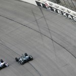 
              Takuma Sato (14) of Japan and Ed Carpenter (20) head into Turn 1 early in the Firestone 600 IndyCar auto race at Texas Motor Speedway Saturday, June 6, 2015, in Fort Worth, Texas. (AP Photo/Ralph Lauer)
            