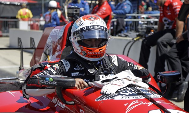 Graham Rahal climbs into his car during practice for the Indianapolis 500 auto race at Indianapolis...