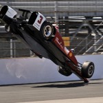 
              The car driven by Helio Castroneves, of Brazil, flips after hitting the wall in the first turn during practice for the Indianapolis 500 auto race at Indianapolis Motor Speedway in Indianapolis, Wednesday, May 13, 2015.  (AP Photo/Dick Darlington)
            