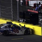 
              Jimmie Johnson (48) hits the pit road wall after spinning in Turn 4 during the NASCAR Sprint Cup series auto race at Charlotte Motor Speedway in Concord, N.C., Sunday, May 24, 2015. (AP Photo/Gerry Broome)
            