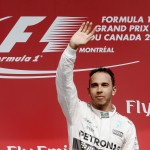 
              Mercedes driver Lewis Hamilton of Great Britain waves to the crowd as he celebrates after winning the Canadian Grand Prix in Montreal on Sunday, June 7, 2015.   (Paul Chiasson/The Canadian Press via AP) MANDATORY CREDIT
            