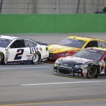 
              Brad Keselowski (2), Jeff Gordon (24), and Joey Logano drive at the front of the field in the early laps of the NASCAR Sprint Cup series auto race at Kentucky Speedway in Sparta, Ky., Saturday, July 11, 2015. (AP Photo/Timothy D. Easley)
            