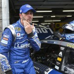 
              Driver Jimmie Johnson wipes sweat from his face as he heads out after completing  practice for Sunday's NASCAR Sprint Cup series auto race at New Hampshire Motor Speedway, Loudon, N.H., Saturday, July 18, 2015  (AP Photo/Cheryl Senter)
            