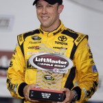 
              Matt Kenseth poses with the trophy after winning the pole position for Sunday's NASCAR Sprint Cup series auto race at Charlotte Motor Speedway in Concord, N.C., Thursday, May 21, 2015. (AP Photo/Chuck Burton)
            