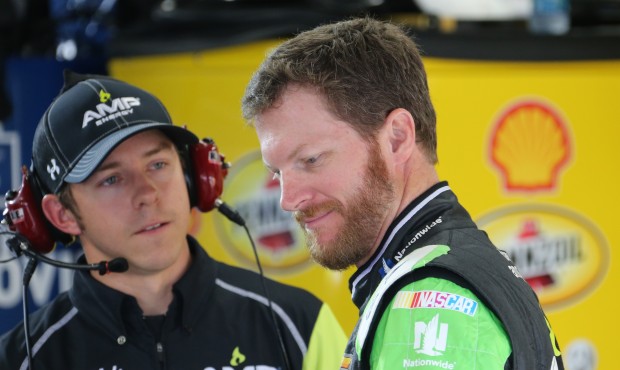 Dale Earnhardt Jr., right, talks with crew chief Greg Ives after practicing for Sunday’s NASC...