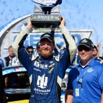               Dale Earnhardt Jr. hoists the trophy in Victory Lane after winning the Talladega 500 NASCAR Sprint Cup Series auto race at Talladega Superspeedway, Sunday, May 3, 2015, in Talladega, Ala. (AP Photo/David Tulis)
            