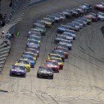 
              The field, headed by pole sitter Denny Hamlin, front left, and Martin Truex Jr., front right, begins the NASCAR Sprint Cup series auto race, Sunday, May 31, 2015, at Dover International Speedway in Dover, Del. (AP Photo/Nick Wass)
            