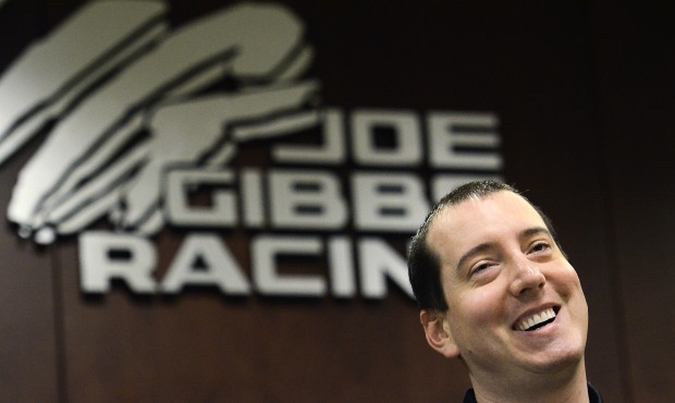 FILE – In this April 15, 21015, file photo, NASCAR Sprint Cup Series driver Kyle Busch smiles...