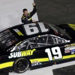 
              Carl Edwards celebrates after winning the NASCAR Sprint Cup series auto race at Charlotte Motor Speedway in Concord, N.C., Sunday, May 24, 2015. (AP Photo/Gerry Broome)
            