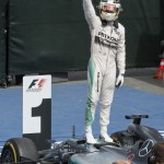 
              Mercedes driver Lewis Hamilton of Great Britain stands on his car as he celebrates his victory at the Canadian Grand Prix in Montreal on Sunday, June 7, 2015. (Paul Chiasson/The Canadian Press via AP) MANDATORY CREDIT
            