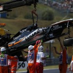 
              The car of Force India driver Sergio Perez of Mexico is removed by a crane after crashing, during the free practice at the Hungarian Formula One Grand Prix in Budapest, Hungary, Friday, July 24, 2015. The Hungarian Formula One Grand Prix will be held on Sunday July, 26. (AP Photo/Darko Vojinovic)
            