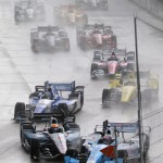 
              James Jakes of England, bottom left, slides into Tony Kanaan of Brazil on the first turn during the first race of the IndyCar Detroit Grand Prix auto racing doubleheader Saturday, May 30, 2015, in Detroit. (AP Photo/Dave Frechette)
            