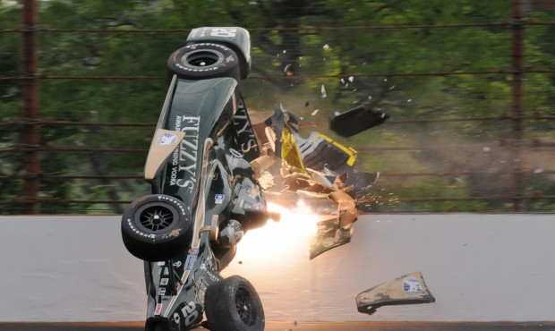Ed Carpenter hits the wall in the second turn during practice before qualifications for the Indiana...