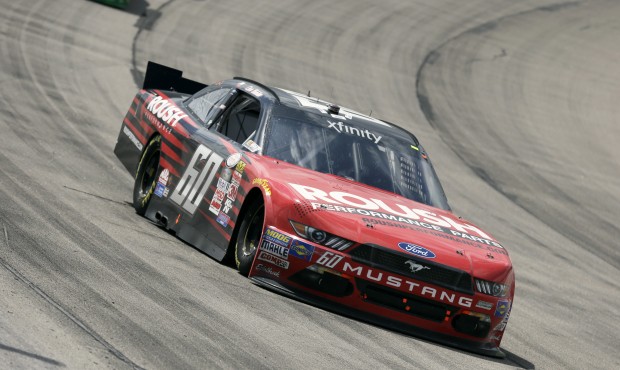 Chris Buescher races his car during the NASCAR Xfinity Series auto race, Sunday, May 17, 2015, at I...