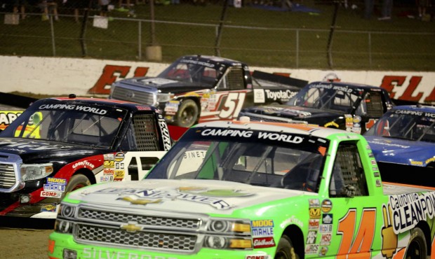 Daniel Hemrick (14) gets to the bottom of the track on the back stretch early in the NASCAR Truck S...