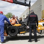 
              The car of Simona de Silvestro, of Switzerland, is lifted back to her garage after catching fire during practice for the Indianapolis 500 auto race at Indianapolis Motor Speedway in Indianapolis, Tuesday, May 12, 2015.  (AP Photo/AJ Mast)
            