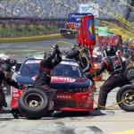 
              Crew members work during a pit stop for driver Austin Dillon's car during the NASCAR Xfinity series auto race at Charlotte Motor Speedway in Concord, N.C., Saturday, May 23, 2015. (AP Photo/Terry Renna)
            