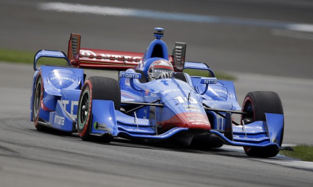 Tony Kanaan, of Brazil, drives through a turn during qualifying for the Grand Prix of Indianapolis ...