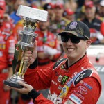 
              Kyle Busch celebrates after winning the NASCAR Brickyard 400 auto race at Indianapolis Motor Speedway in Indianapolis, Sunday, July 26, 2015. (AP Photo/Michael Conroy)
            