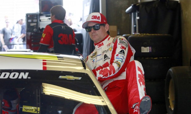 Sprint Cup Series driver Jeff Gordon (24) climbs into his car during practice for the NASCAR Bricky...