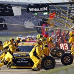
              Crew members perform a pit stop on driver Matt Kenseth's car during the NASCAR Sprint Cup series auto race at Charlotte Motor Speedway in Concord, N.C., Sunday, May 24, 2015. (AP Photo/Terry Renna)
            