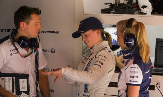Williams Martini test driver British’s Susie Wolff, center, talks with team mates during the ...
