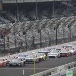 
              Cars come to the start/finish line as the green flag drops to start the NASCAR Xfinity Series auto race at Indianapolis Motor Speedway in Indianapolis, Saturday, July 25, 2015. (AP Photo/AJ Mast)
            