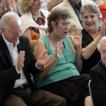 
              Margaret Turner Wright, center, reacts with her husband Barry Wright, left, and Patsy Agner, right, after her father, Curtis Turner, was named to the 2016 class of the NASCAR Hall of Fame during an announcement at the hall in Charlotte, N.C., Wednesday, May 20, 2015. (AP Photo/Chuck Burton)
            