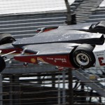
              AP10ThingsToSee - The car driven by Helio Castroneves, of Brazil, is airborne after hitting a wall in the first turn during practice for the Indianapolis 500 auto race at Indianapolis Motor Speedway in Indianapolis on Wednesday, May 13, 2015. The car landed upside down before rolling onto its wheels but Castroneves was not seriously hurt. (AP Photo/Joe Watts)
            