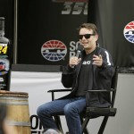 
              Jeff Gordon gestures while taking part in a question and answer session with fans before the start of qualifying at the NASCAR Sprint Cup Series auto race Saturday, June 27, 2015, in Sonoma, Calif. (AP Photo/Eric Risberg)
            