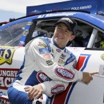 
              A.J. Allmendinger poses by his car after winning the pole position qualifying for the NASCAR Sprint Cup Series auto race Saturday, June 27, 2015, in Sonoma, Calif. (AP Photo/Eric Risberg)
            