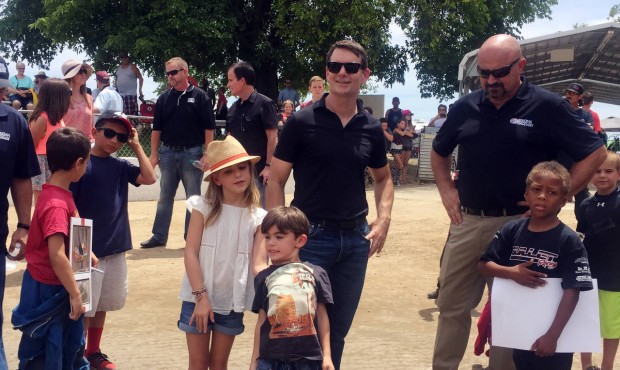 In this photo taken Saturday, June 20, 2015, NASCAR driver Jeff Gordon shows his children, Ella and...