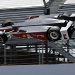
              The car driven by Helio Castroneves, of Brazil, is airborne after hitting the wall in the first turn during practice for the Indianapolis 500 auto race at Indianapolis Motor Speedway in Indianapolis, Wednesday, May 13, 2015.  (AP Photo/Joe Watts)
            