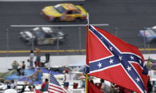 FILE – In this Oct. 7, 2007, file photo, a Confederate flags fly in the infield as cars come ...