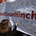 
              Deb Sparks signs a "Get Well Soon Hinch" banner in the garage area before the practice session for the Indianapolis 500 auto race at Indianapolis Motor Speedway in Indianapolis, Friday, May 22, 2015. James Hinchcliffe, of Canada, was injured in a crash on Monday and is being replaced by Ryan Briscoe, of Australia. (AP Photo/Darron Cummings)
            