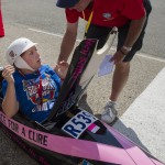
              Kelsey Settles of Owensboro, Ky., reacts after being told by Derby volunteers that she is the winner of the Rally Masters Division at the All-American Soap Box Derby in Akron, Ohio,  Saturday, July 25, 2015. (AP Photo/Phil Long)
            