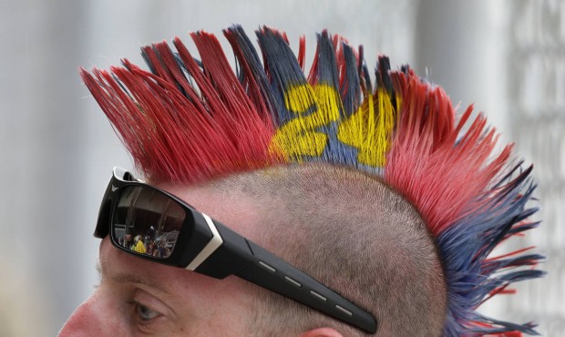 A fan has his hair painted to honor driver Jeff Gordon during the NASCAR Brickyard 400 auto race at...