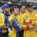
              Marco Andretti, front left,  and Ryan Hunter-Reay, front right, watch the wreck of James Hinchcliffe, of Canada, on a video screen during practice for the Indianapolis 500 auto race at Indianapolis Motor Speedway in Indianapolis, Monday, May 18, 2015.  (AP Photo/Darron Cummings)
            