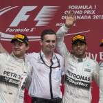 
              From left, second place Mercedes driver Nico Rosberg of Germany, Mercedes race engineer Riccardo Musconi , winner Lewis Hamilton, of Great Britain, and third place Williams driver Valtteri Bottas, of Finland, wave from the podium during victory ceremonies at the Canadian Grand Prix Sunday, June 7, 2015 in Montreal. (Paul Chiasson/The Canadian Press via AP) MANDATORY CREDIT
            