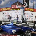 
              Max Chilton leaps in Victory Lane after winning the Indy Lights Series auto race Saturday, July 18, 2015, at Iowa Speedway in Newton, Iowa. (AP Photo/Charlie Neibergall)
            