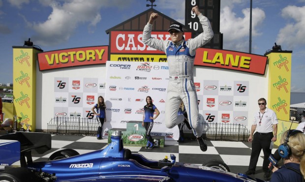 Max Chilton leaps in Victory Lane after winning the Indy Lights Series auto race Saturday, July 18,...